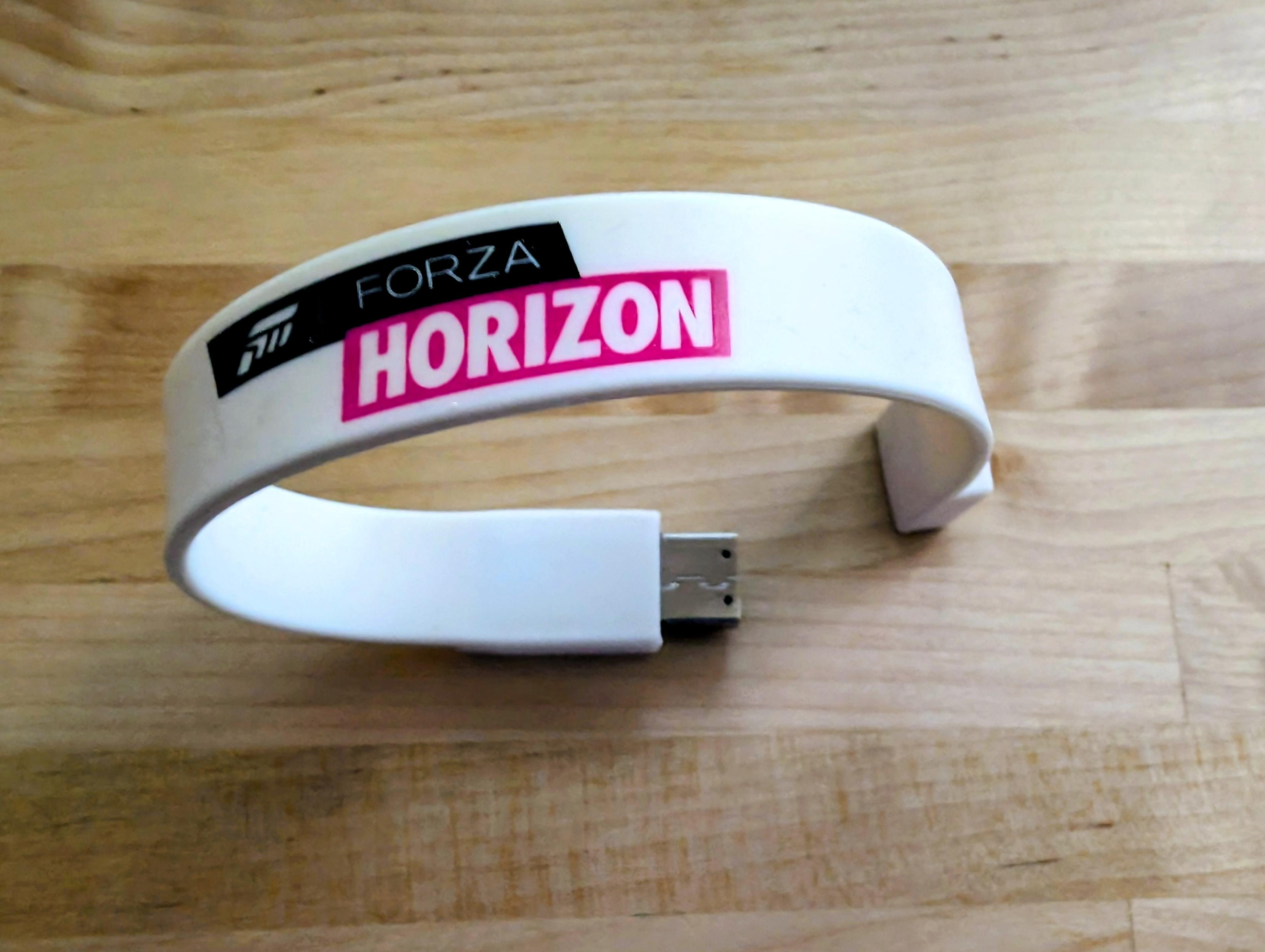 A picture of a Forza Horizon USB wristband.
